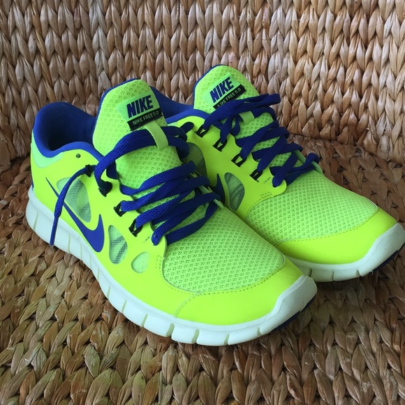 blue and neon yellow nike shoes